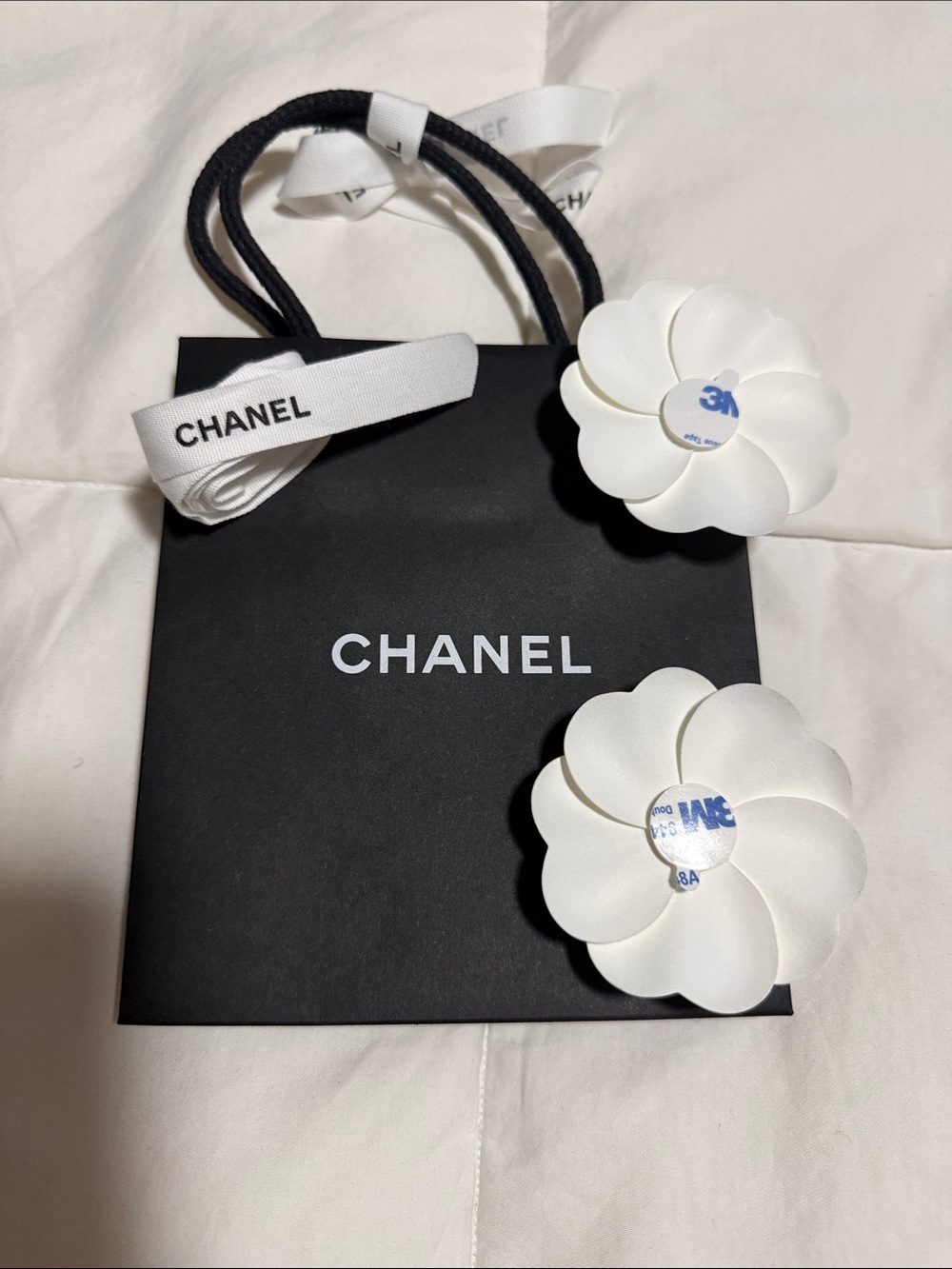 CHANEL Mini Black Shopping Bag with White Camellia Accents